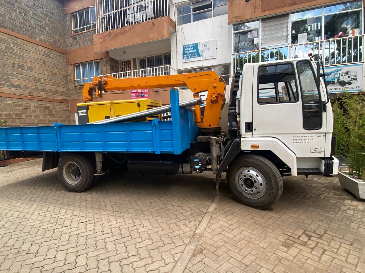 Generator and power equipment loaded on a truck with crane support